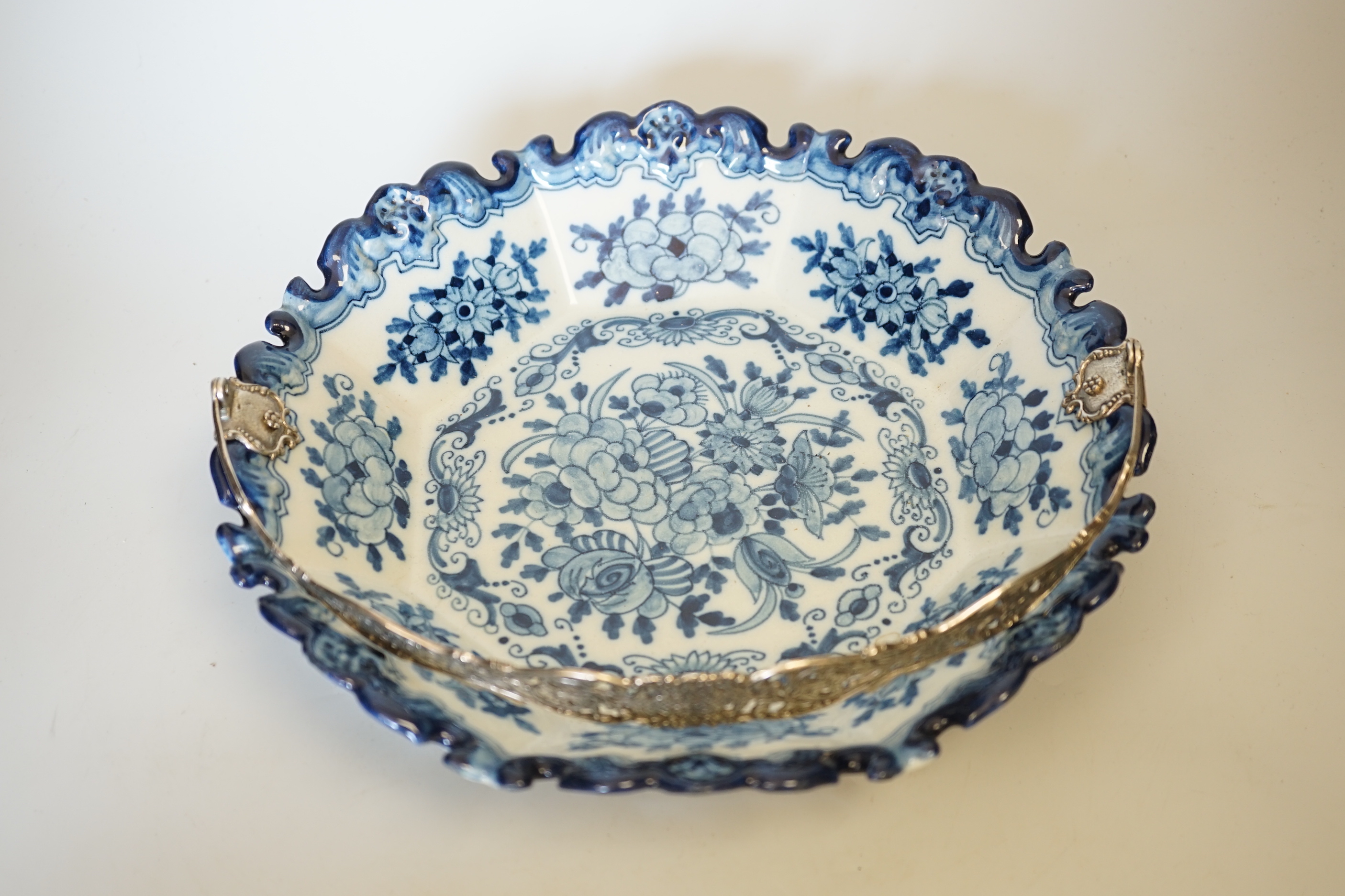 Two delftware dishes, largest 26cm, and a delftware clog